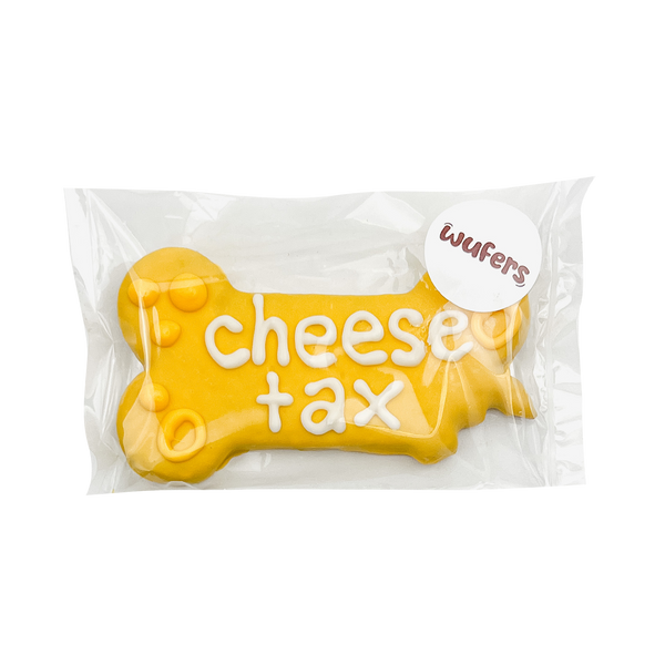 6" Bone Dog Treat that says 'Cheese Tax' and packaged. Made in North America and with locally sourced ingredients.