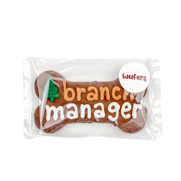 6" Bone Dog Treat that says 'Branch Manager' and packaged. Made in North America and with locally sourced ingredients.